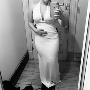 White floor length plunging v-neck dress. Never worn besides dressing room.